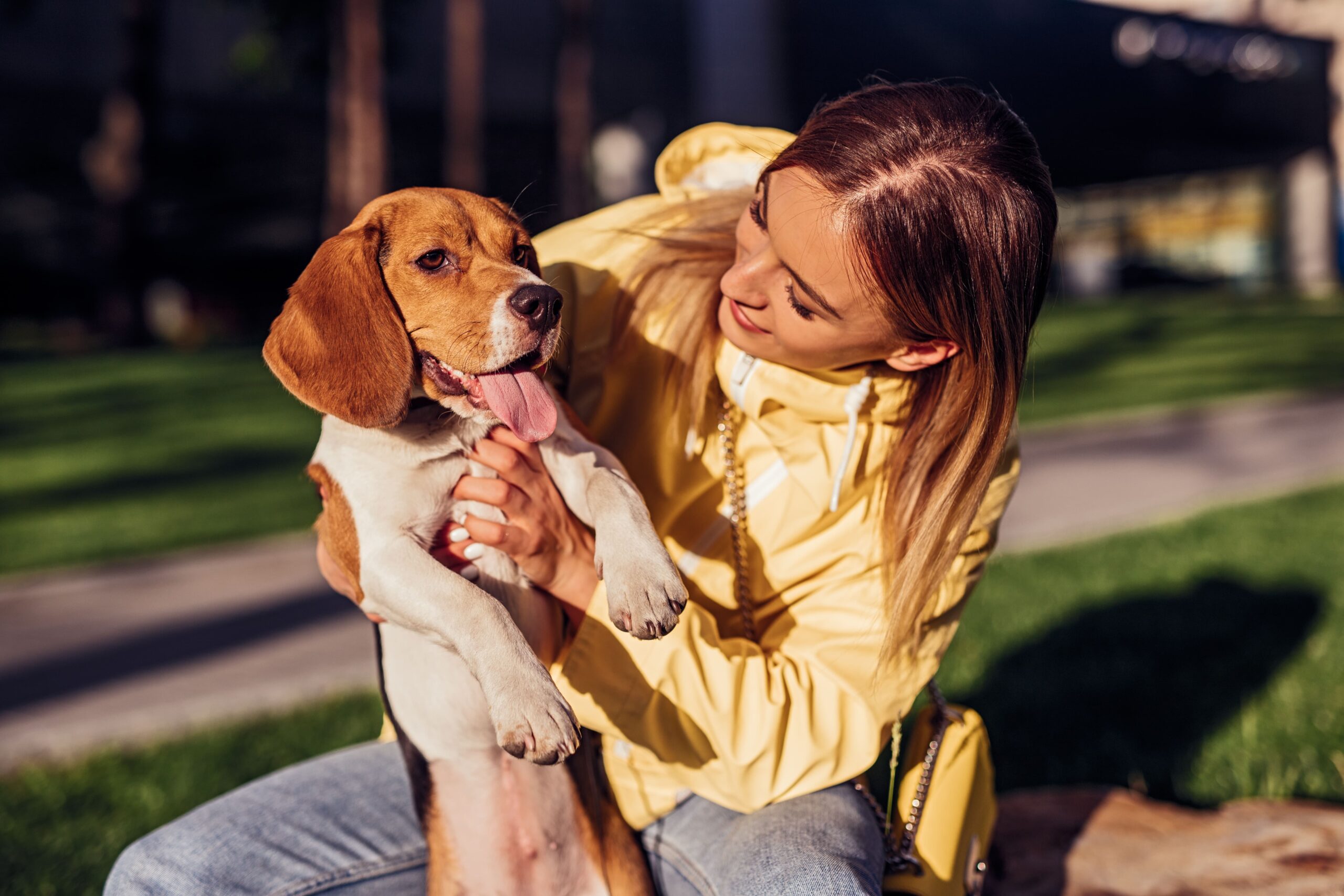 young-woman-with-dog-in-park-2022-11-12-14-25-56-utc